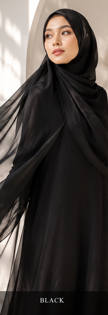 Person wearing a black georgette hijab and black outfit with a blurred background