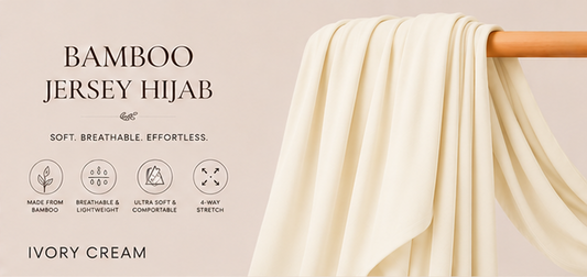 Ivory cream bamboo jersey hijab on a wooden rod with product features listed.