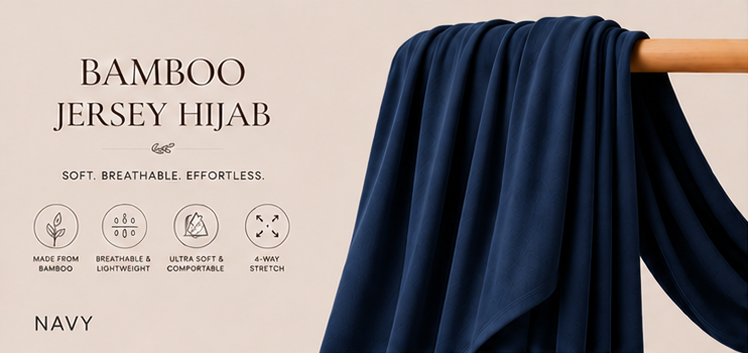 Navy Blue bamboo jersey hijab on a wooden rod with product details on a beige background