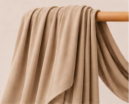 Beige bamboo jersey hijab on a wooden rod with product features listed.