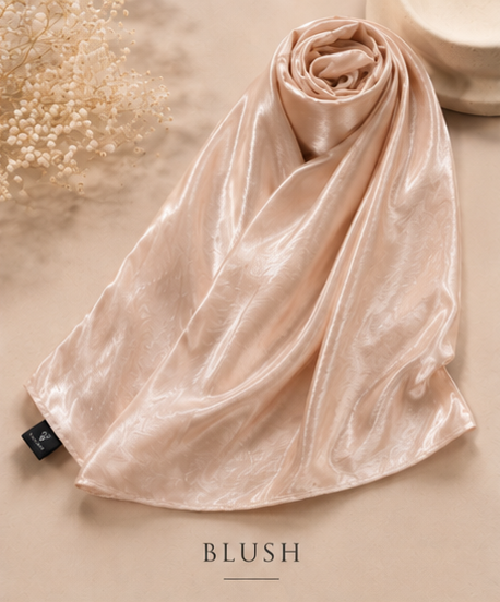 Blush pink Bubble satin Islamic Hijab scarf on a beige surface with 'BLUSH' text
