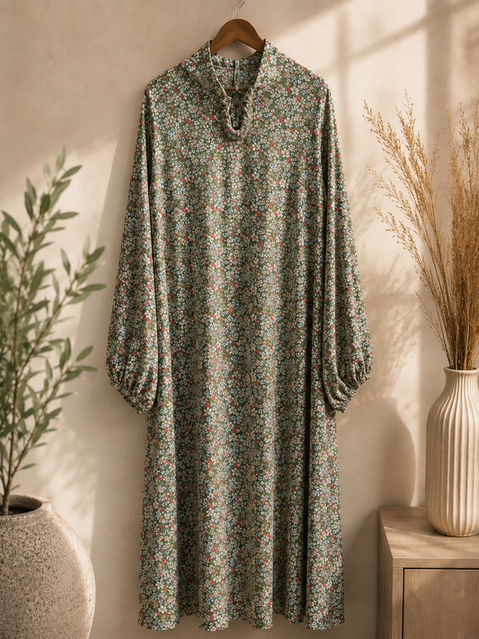 Premium Olive Green Floral Islamic Prayer and Namaz dress on a hanger against a neutral wall with decorative elements.
