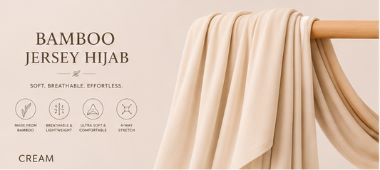 Cream-colored bamboo jersey hijab on a wooden rod with product features listed.