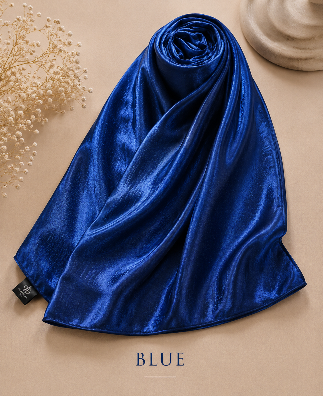 Dark Blue Bubble Satin Islamic Hijab Scarf on a beige surface with 'BLUE' text