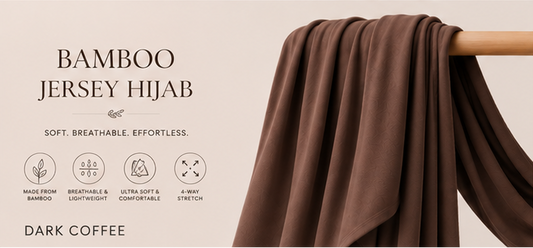 Dark Coffee Brown bamboo jersey hijab on a wooden rod with product features listed.