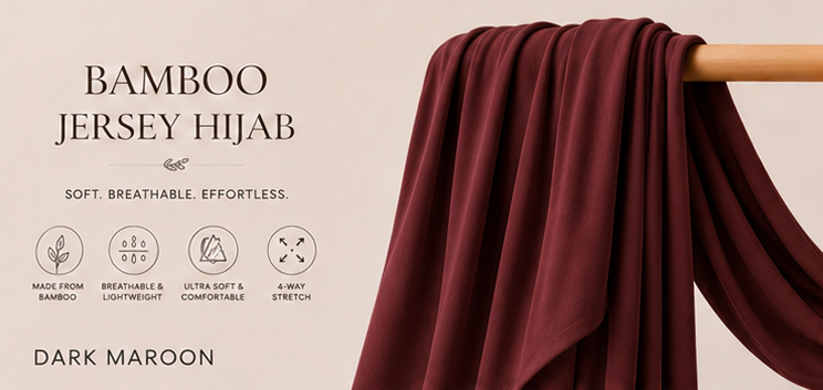 Dark maroon bamboo jersey hijab on a wooden stick with product details on a beige background.