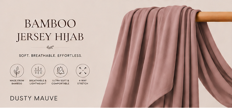 Bamboo jersey hijab in dusty mauve color on a wooden rod with product features listed.