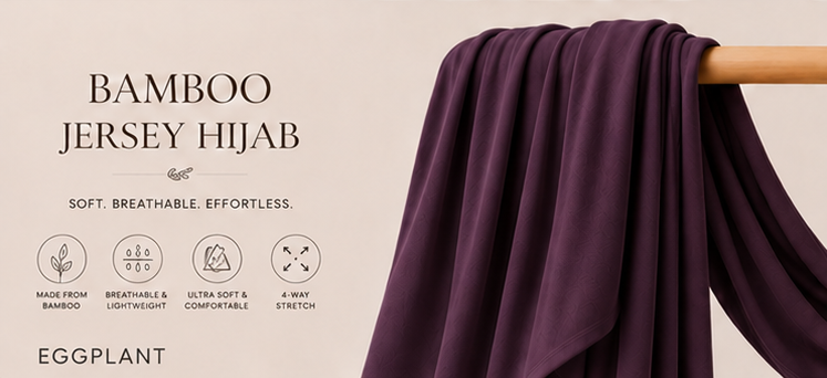 Eggplant purple bamboo jersey hijab on a wooden stick with product features listed.