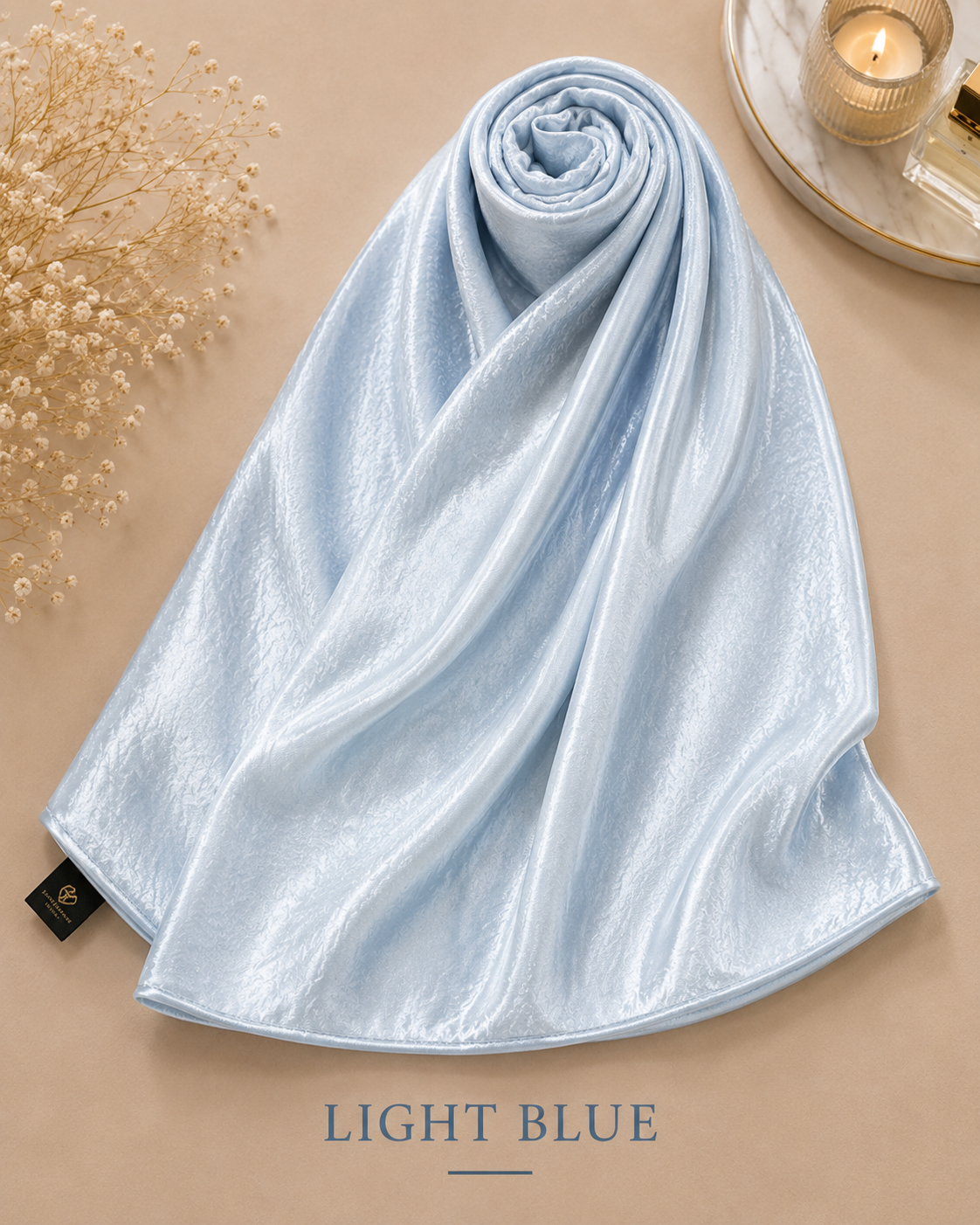 Light Blue Bubble Satin Islamic Hijab Scarf on a beige surface with 'Light BLUE' text
