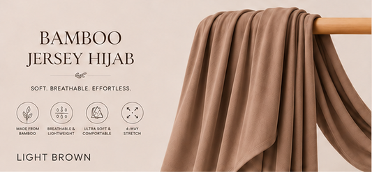 Light brown bamboo jersey hijab on a wooden rod with product features listed.