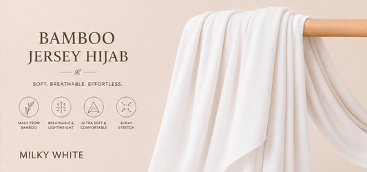 Milky White bamboo jersey hijab on a wooden rod with product features listed.