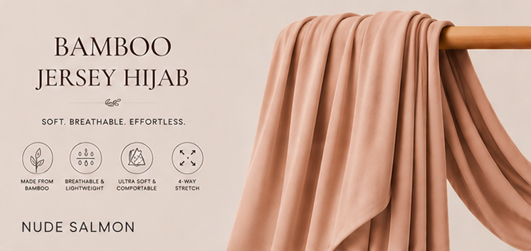 Nude salmon bamboo jersey hijab on a wooden rod with product features listed.