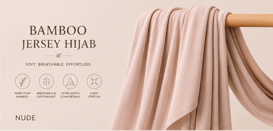 Nude bamboo jersey hijab on a wooden rod with product features listed.