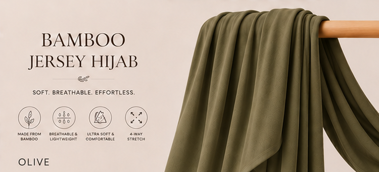 Olive green bamboo jersey hijab on a wooden stick with product features listed.