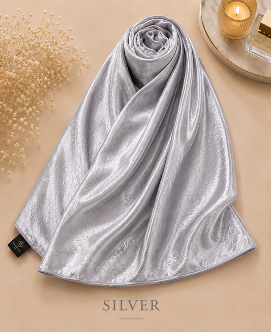 Silver Bubble Satin Islamic Hijab Scarf on a beige surface with decorative elements