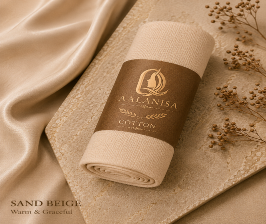 Roll of sand beige premium modal cotton hijab fabric with Aala nisa branding on a textured beige background